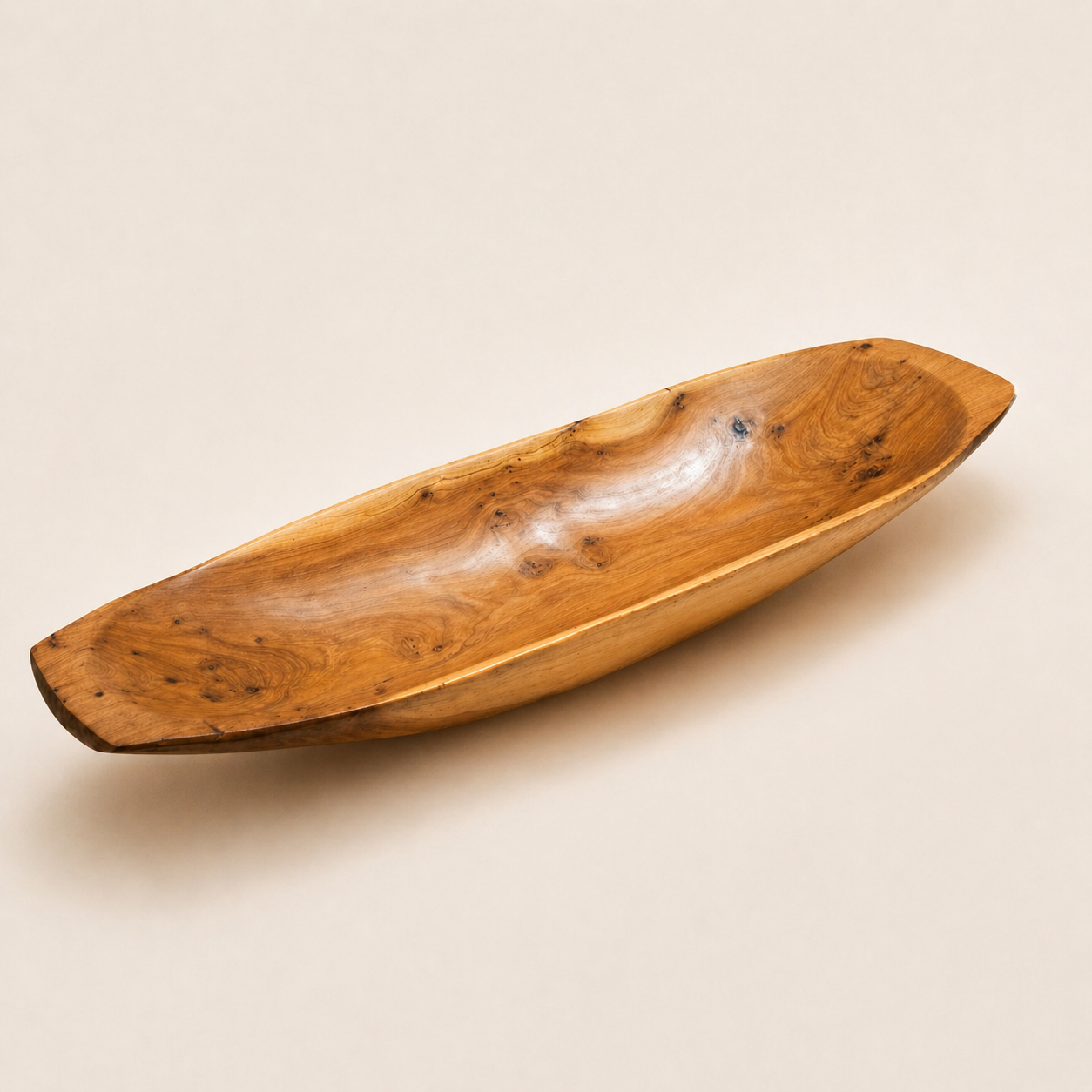Moroccan burl wood long serving dish with smooth curved shape