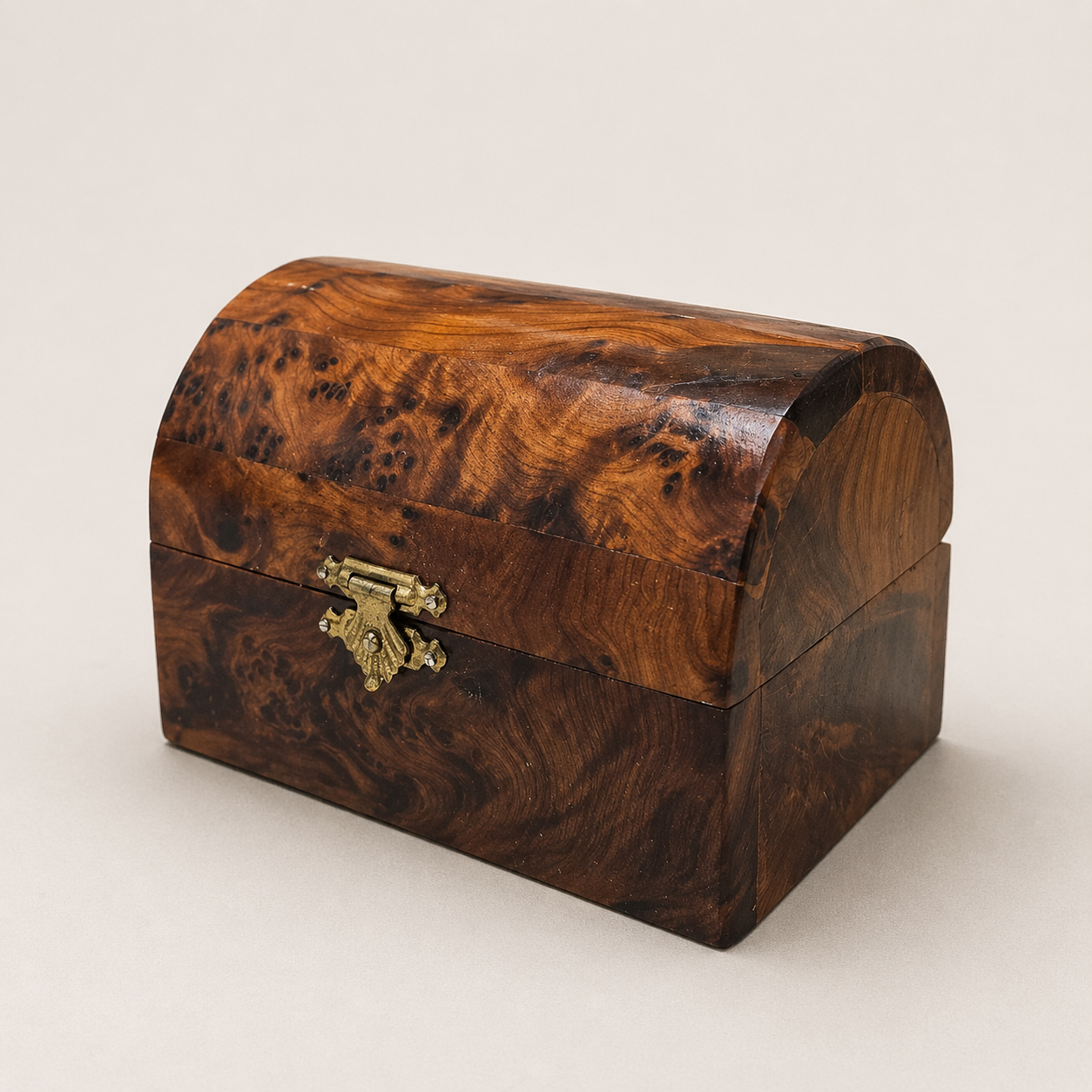 Moroccan burl wood treasure box with rounded lid and brass latch